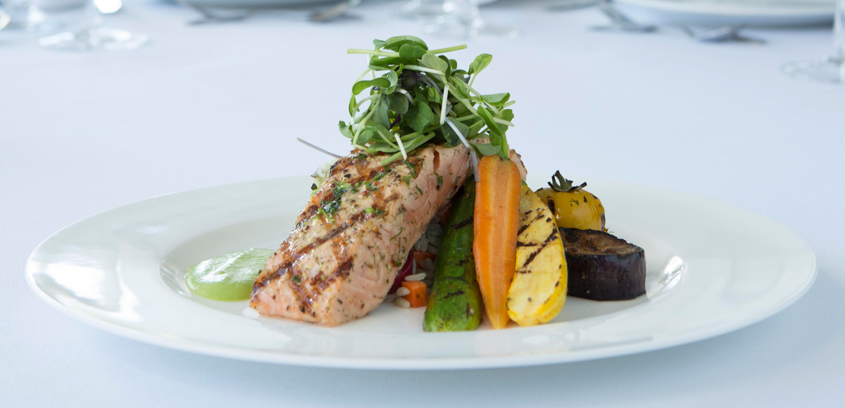 Perfectly grilled salmon with colourful vegetables.